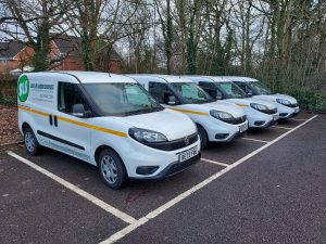 Skilled Labour Services branded vans in a row in a car park